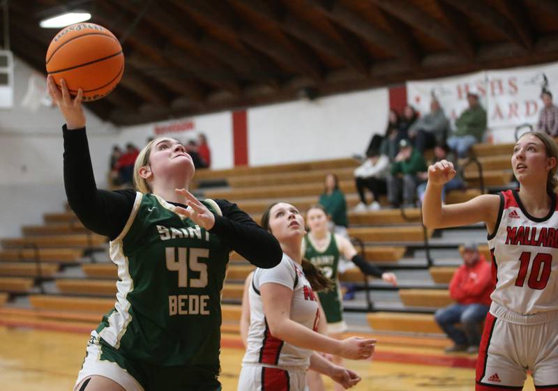 St. Bede's Savannah Bray eyes the hoop while scoring on a layup over Henry-Senachwine's Kaitlyn Anderson and teammate Rachael Eckert on Thursday, Jan. 30, 2025 at Henry-Senachwine High School.