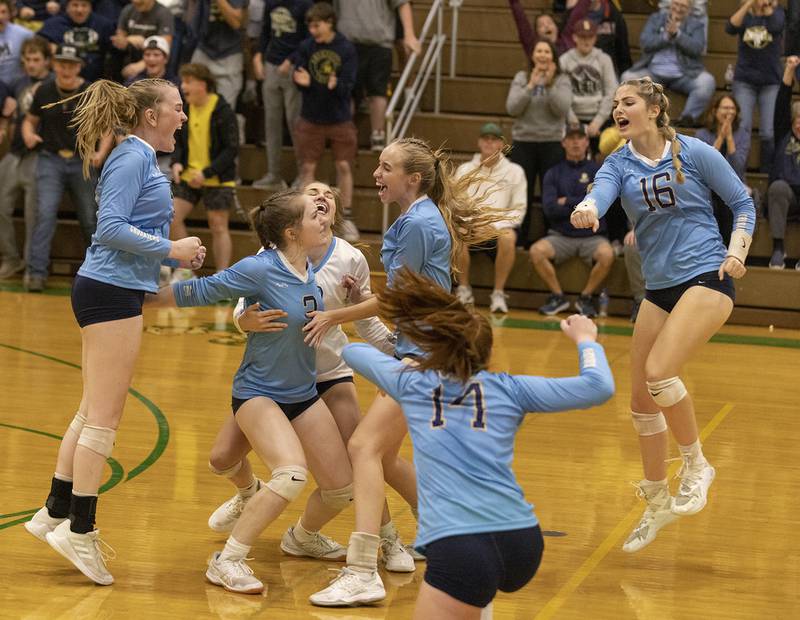 From left, Marquette's Kaylee Killelea, Nora Rinearson, Lindsey Kaufmann, Lilly Craig, Avery Durdan and Eva McCallum celebrate the final point of Thursday's Tri-County Tournament win over Seneca on Oct. 13, 2022.