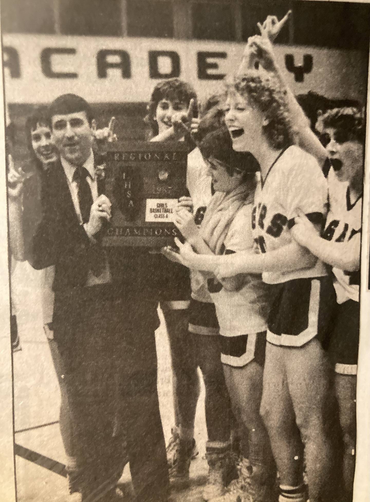 PHS coach John Smith and the Tigresses celebrate their regional championship in 1987.