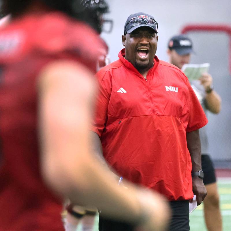 Northern Illinois University football head coach Thomas Hammock makes a point with a player Wednesday, July 31, 2024, during practice in the Chessick Practice Center at NIU.