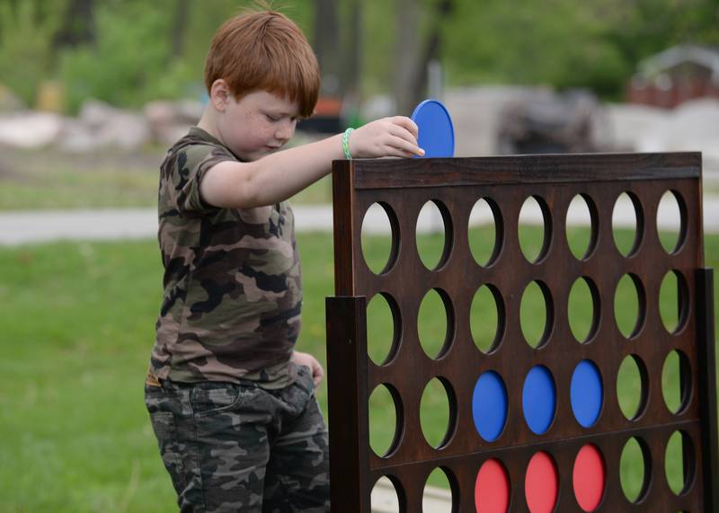 Children including Griffin Boyd of Schaumburg enjoy outdoor games while attending  Cantigny's Spring Fling and Market Saturday May 13, 2023.
