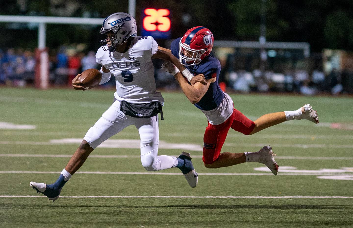 West Aurora's Joseph Pokryfke (7) chases down Oswego East's Tre Jones (9) during a high school football game at West Aurora High School in Aurora on Friday, Sep 24, 2021.