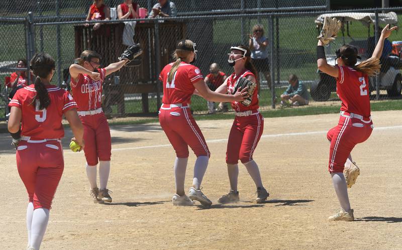 Oregon infielders celebrate after an out during the championship game against Rock Falls at 2A Oregon Regional on Saturday, May 23, 2026 at Oregon Park West.