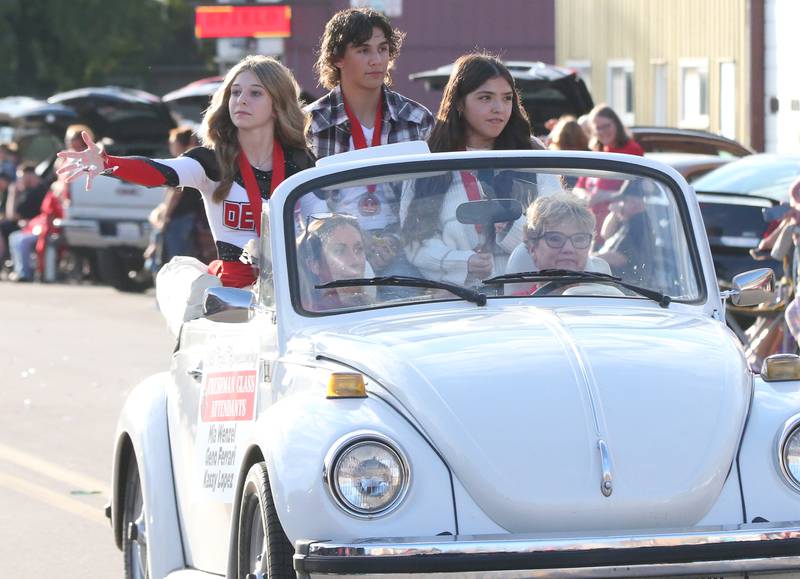 Hall High School freshman attendants Mia Wenzel, Geno Ferrari and Kassy Lopez ride during the Hall High School Homecoming parade on Thursday, Sept. 28, 2023 in Spring Valley.
