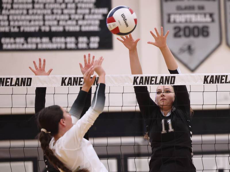 Kaneland's Natalie Remsen tries to block a spike by Sycamore's Maggie Hasselbring during their match Tuesday, Sept. 30, 2025, at Kaneland High School in Maple Park.