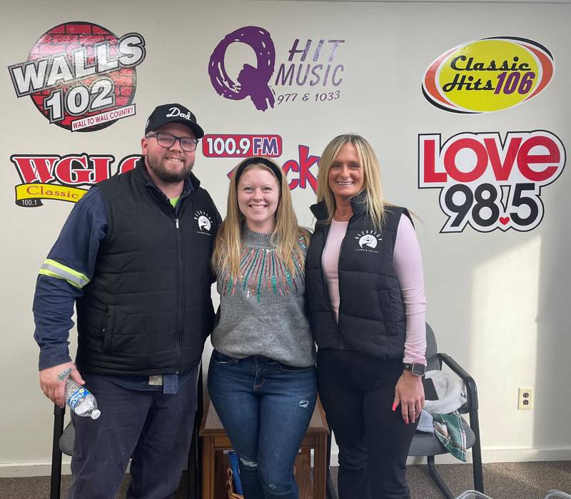 Illinois Valley Recovery leaders Tyler Phillips (left) and Sarah Jones (right) with Walls 102's Dani Holland (center)