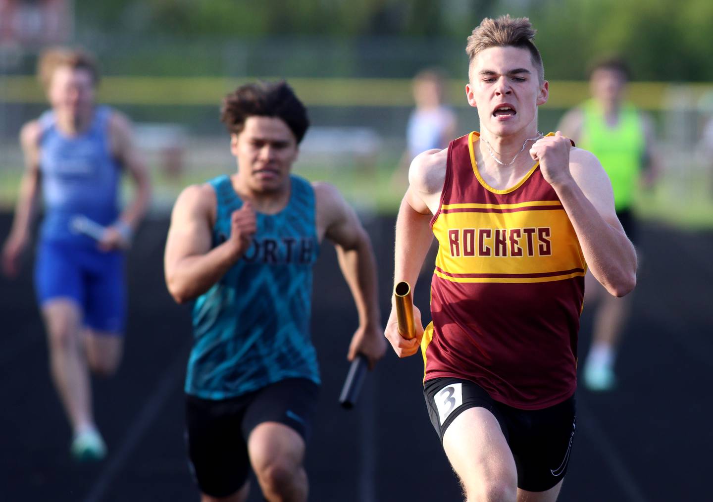 Richmond-Burton’s Jack Martens anchors the Rockets’ 800-meter relay during Kishwaukee River Conference track meet action at Marengo Tuesday night.
