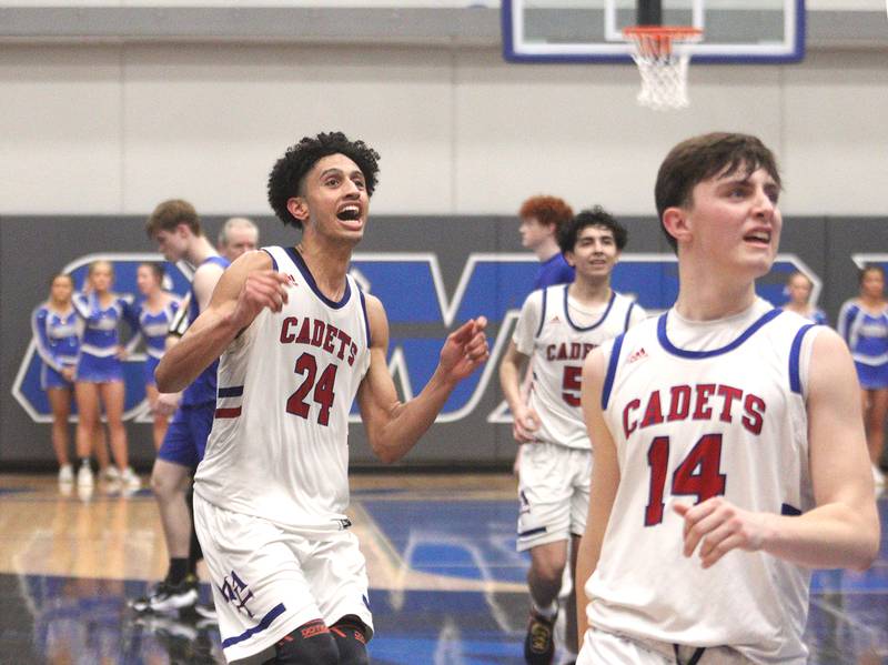 From left, Marmion Academy’s Trevon Roots, Jacob Piceno and Evan Stumm watch the clock tick down at the end of the game in IHSA Class 3A Sectional title game action at Burlington Central High School Friday night.