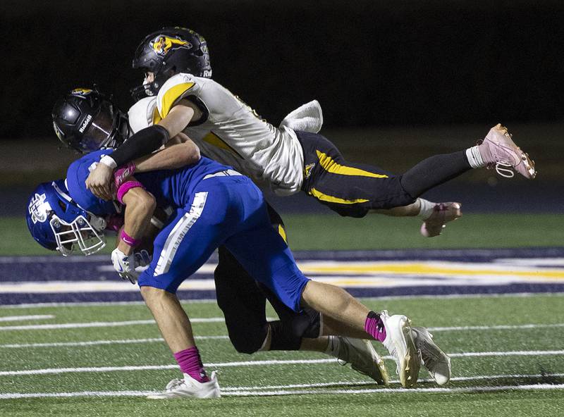 Newman’s Brady Williamson is tackled after recovering a dropped punt against Riverdale Friday, October 11, 2024, in Sterling.