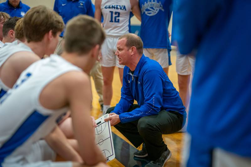 Geneva’s head coach Scott Hennig talks to his players during a break in play against Wheaton North during a basketball game at Geneva High School on Friday, Jan 6, 2023.