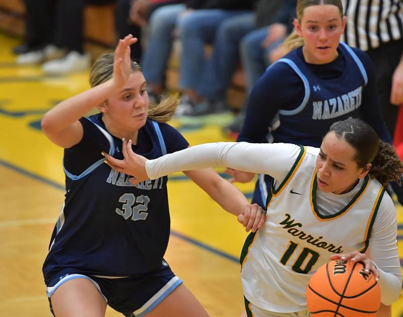 Waubonsie Valley’s Danyella Mporokoso (10) drives as Nazareth’s Stella Sakalas (32) defends during the Class 4A Lyons Supersectional game on March 2, 2026 at Lyons Township High School in LaGrange.