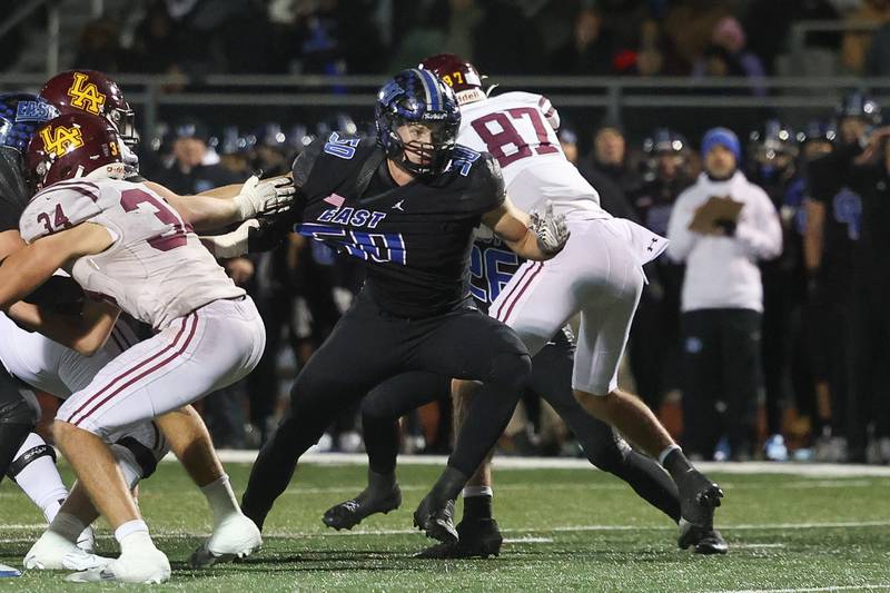 Lincoln-Way East’s Caden O’Rourke breaks through the offensive line against Loyola in the Class 8A semifinal on Saturday, Nov. 23, 2024 in Frankfort.