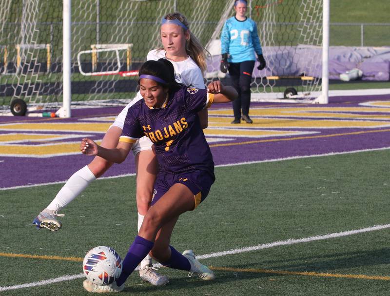 Mendota's Crystal Garcia kicks the ball in front of Princeton's Chloe Ostrowski during the Class 1A Regional semifinal game on Tuesday, May 9, 2023 at Mendota High School.