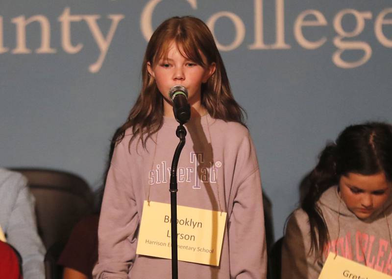 Brooklyn Larson of Harrison Elementary School in Wonder Lake competes in the McHenry County Regional Office of Education's 2023 spelling bee Wednesday, March 22, 2023, at McHenry County College's Luecht Auditorium in Crystal Lake.