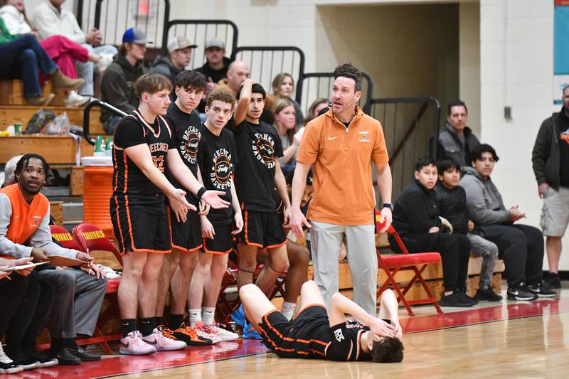 Beecher head coach Tyler Shireman looks to the referee in absence of a foul call for Dominick DeFrank, on ground, on Friday, Feb. 14, 2025, during the Bobcats' 70-38 loss to St. Anne in the River Valley Conference championship.