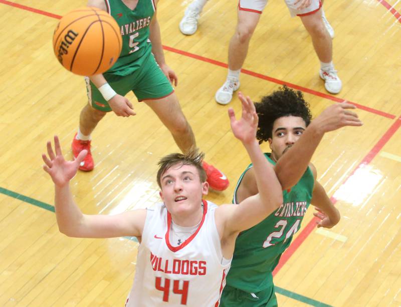Streator's Nolan Lukach looks to grab a rebound over L-P's Marion Persich during the Class 3A Regional title game on Friday, Feb. 28, 2025 in Sellett Gymnasium at L-P High School.
