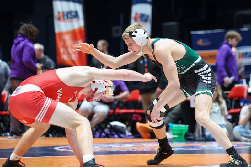 Coal City's Luke Munsterman, right, wrestles Vandalia's Brody Matthews in the 138-pound match during the Coalers' victory in the IHSA Class 1A Dual Team State championship on Saturday, Feb. 28, 2026.
