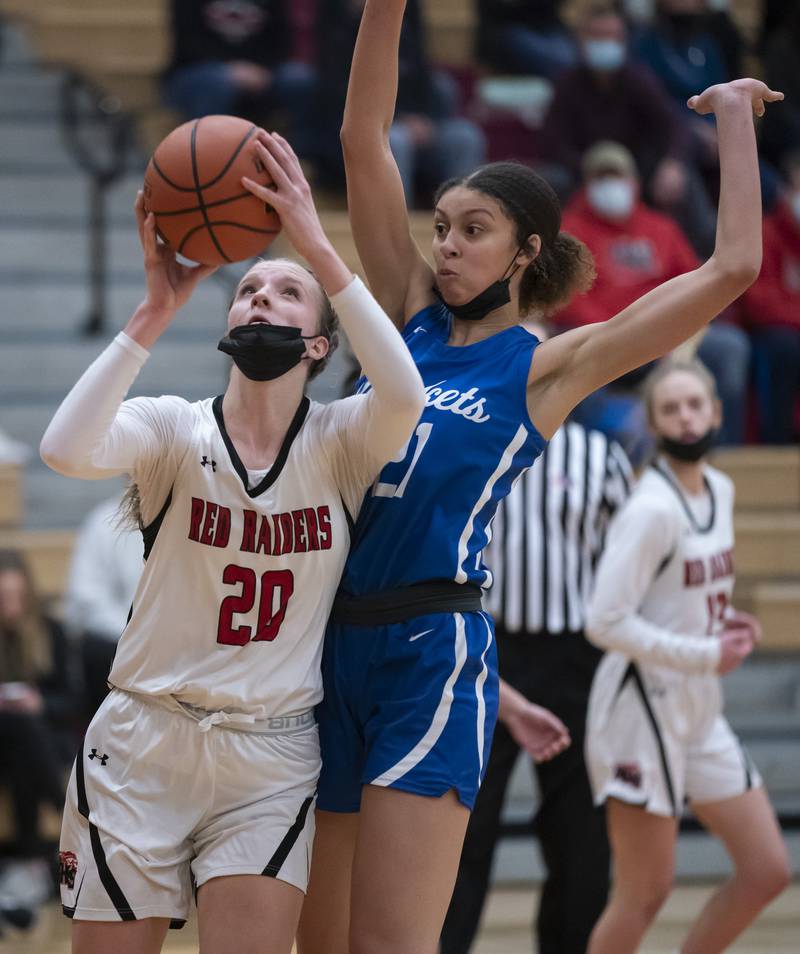 Huntley's Jori Heard takes a shot as Burlington Central's Taylor Charles defends during their game on Saturday, January 29, 2022 at Huntley High School. Huntley won 52-49.