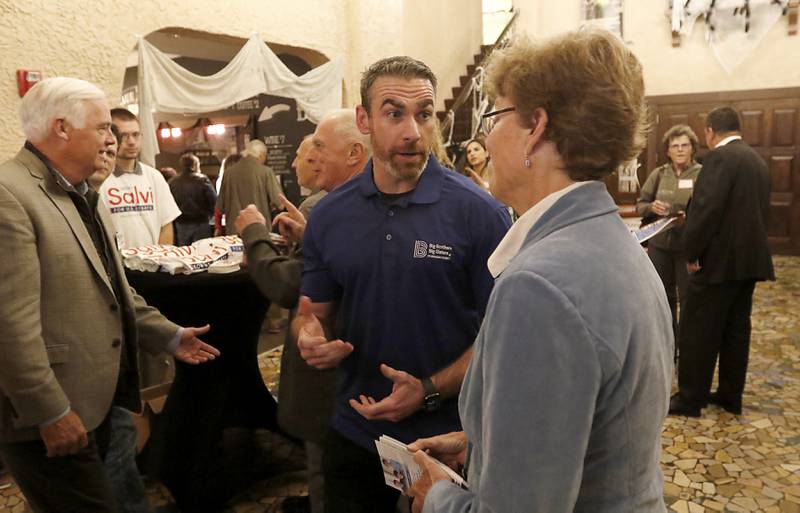 Republican McHenry County sheriff candidate Robb Tadelman talks with Republican McHenry County treasurer candidate Donna Kurtz during a meet-and-greet event Wednesday, Oct. 12, 2022, for Republican candidates across the state and county at the Raue Center for the Arts, 26 N. Williams St. in Crystal Lake. The event gave voters a chance to discuss a number of key issues and talk with candidates.