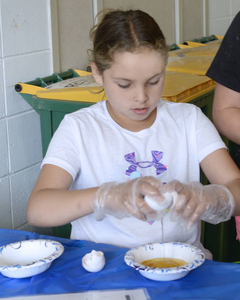 Ariella Smith cracks open an egg as she prepares to make Eggs Ole! on Friday, June 30, 2023, at Northlawn Junior High School in Streator during the Illinois Junior Chefs class. The University of Illinois Extension, OSF Health, Live Well Streator and Streator Salvation Army coordinated the weeklong class.