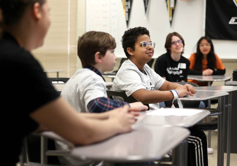 Students listen to Devonte Merrick, assistant band director at DeKalb High School, as he talks about the science of sound Saturday, April 5, 2025, during Barb STEAMCon at Dekalb High School. The event featured sessions focusing on the areas of science, technology, engineering, arts and math.
