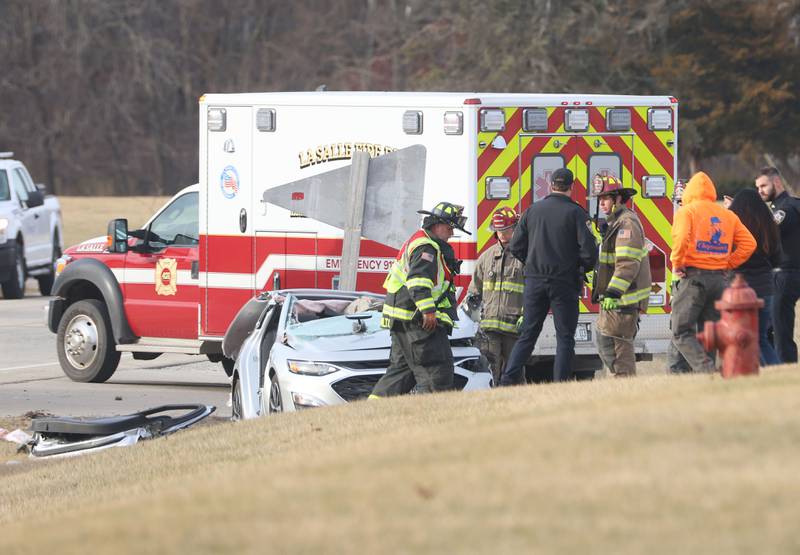 La Salle Police, Fire and EMS work the scene of a three vehicle crash near the entrance to La Sale Speedway on Monday, Jan. 12, 2026 on U.S. Route 6 in La Salle. The crash happened around 8:30a.m. Crews from Utica and La Salle responded to the scene. OSF Lifeflight helicopter landed in the parking lot of La Salle Speedway to transport one patent.