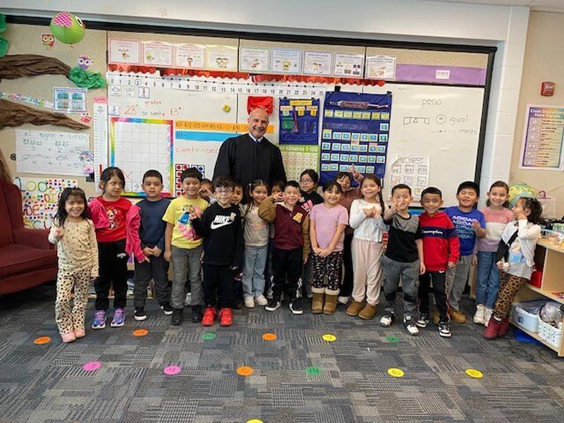 Twenty-one 19th Judicial Circuit Judges made classroom appearances, dressed in black robes, to read books to the students and donate various items to the schools.