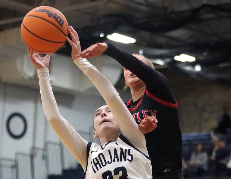 Huntley’s Anna Campanelli, back, battles Cary-Grove’s  Avery Hoffman for the ball in varsity girls basketball on Friday, Jan. 24, 2025, at Cary-Grove High School in Cary.
