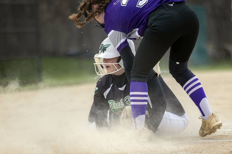 Rock Falls’ Kora Hosler slides in safely after stealing home against Rockford Lutheran Thursday, April 10, 2025.