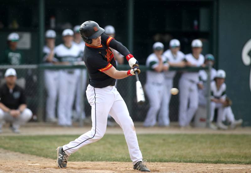 Batavia’s Ryan Boe hits a triple during a game against Glenbard West at Village Green Park in Glen Ellyn on Wednesday, March 13, 2024.