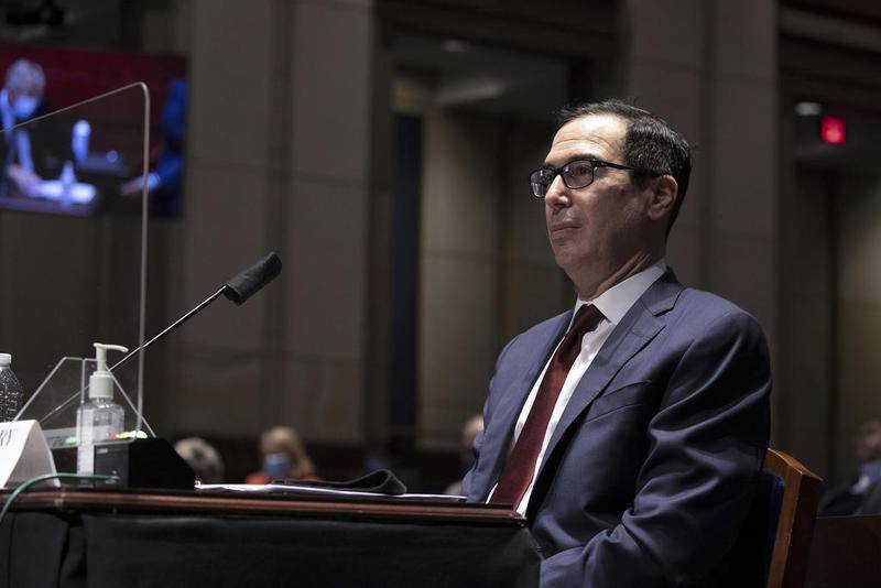 FILE - In this June 30, 2020 file photo, Treasury Secretary Steven Mnuchin testifies during a House Financial Services Committee hearing on the coronavirus response on Capitol Hill in Washington. The Treasury Department said it is releasing on Monday, July 6 the names of more than 700,000 companies that received funds from the government's small business lending program, a massive effort intended to support the economy as states shut down in April to contain the viral outbreak (Tasos Katopodis/Pool via AP, File)
