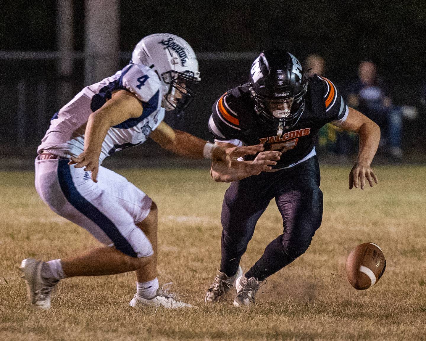 Rob Sandberg (4) of Ridgewood and Leelynd Durbin (7) of FCW fight over possession of loose ball on Friday, Sept. 26, 2025, at Woodland School in rural Streator.