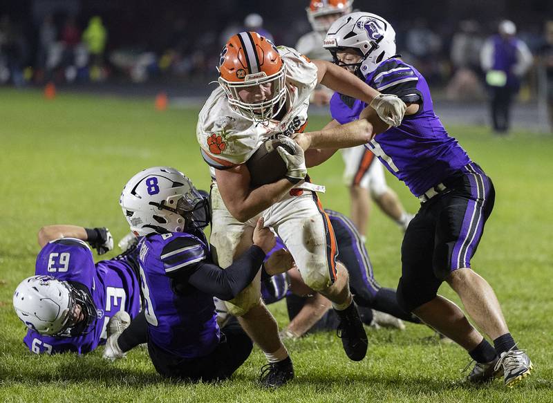 Byron’s Caden Considine fights for the goal line for a Tiger TD against Dixon Friday, Oct. 18, 2024, at A.C. Bowers Field in Dixon.