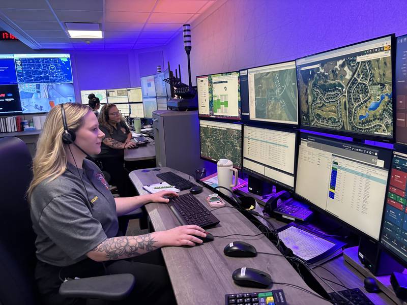 SEECOM dispatchers, Natalie Pergler, left and Mya Warner work in the dispatch center in Crystal Lake, Monday, April 20, 2026.