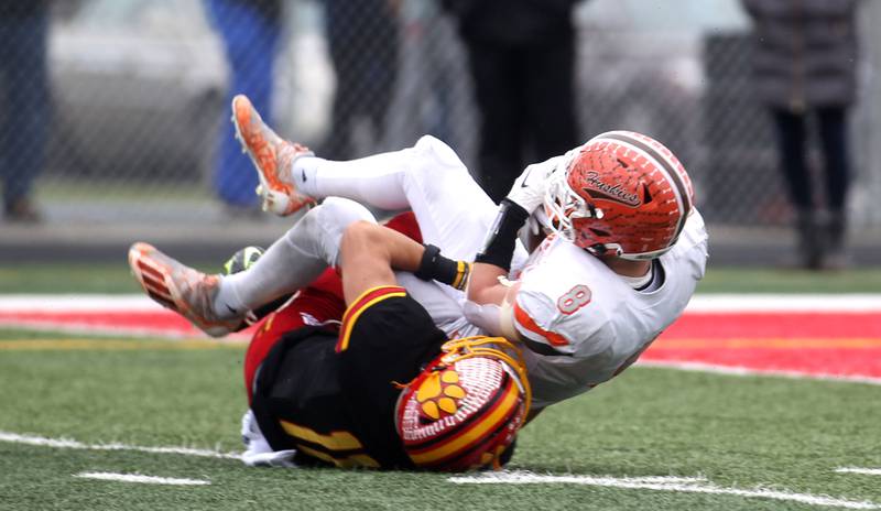Hersey’s Carson Grove (8) is taken down by Batavia’s Drew Gerke during their Class 7A second-round playoff game in Batavia on Saturday, Nov. 5, 2022.