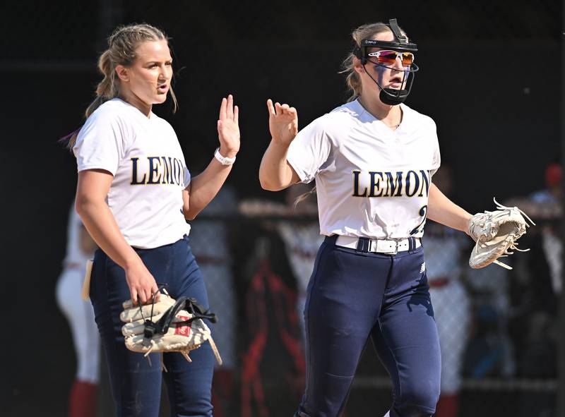 Lemont's Sage Mardjetko and Avaree Taylor high five after closing out the 4th inning during the Lemont Class 3A Sectional Final game against Ottawa on Friday, June. 02, 2023, at Lemont.