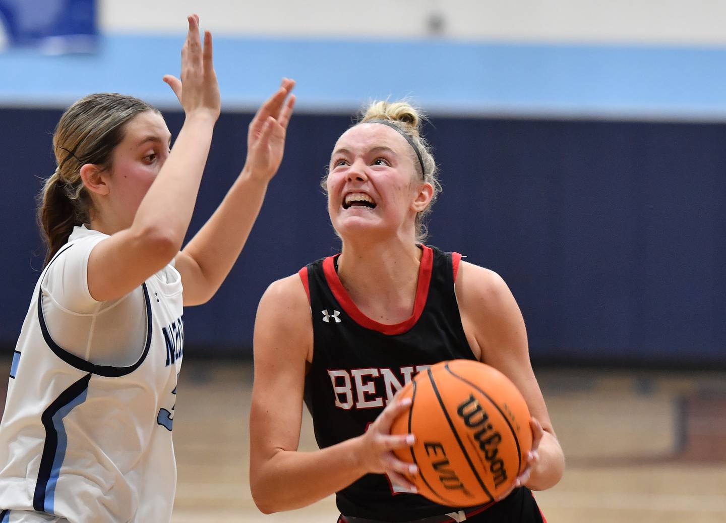 Benet’s Bridget Rifenburg goes to the basket as she is defended by Nazareth’s Stella Sakalas during a game on December 13, 2025 at Nazareth Academy in LaGrange Park.