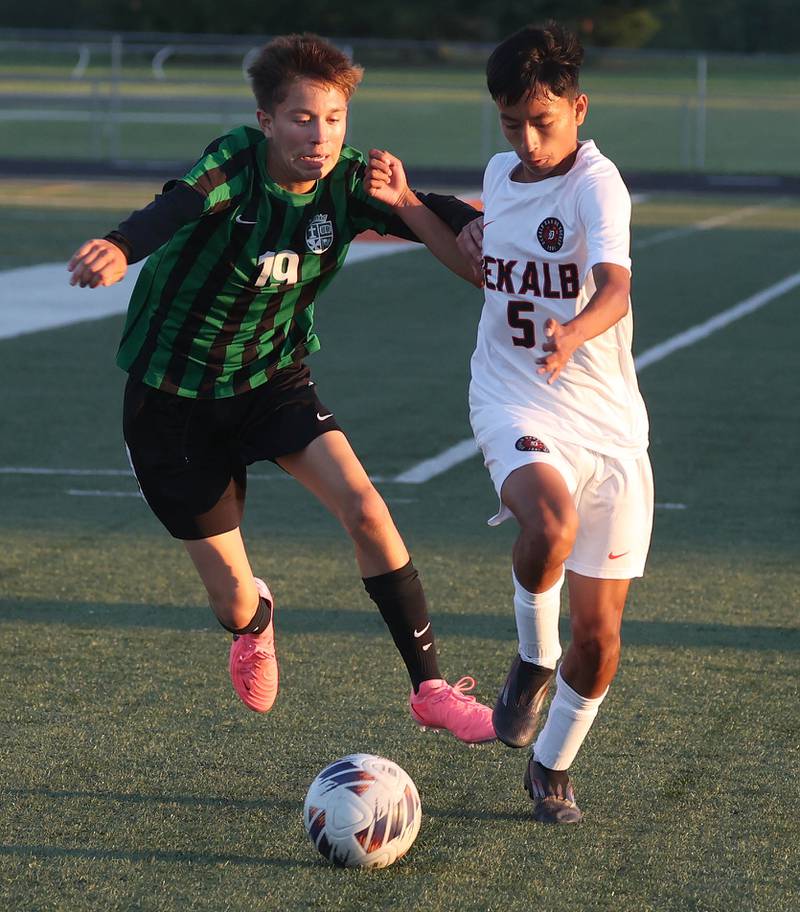 DeKalb's Brandon Cervantes tries to hold off St. Edward's Omar Garcia Thursday, Aug. 28, 2025, during their game in the Barb Cup tournament at DeKalb High School.