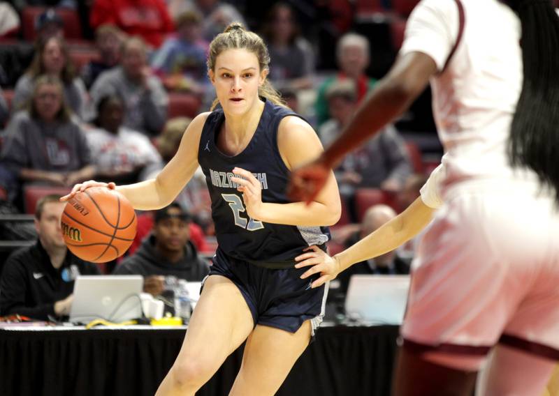 Nazareth Academy's Grace Carstensen drives toward the basket during the Class 3A girls basketball state semifinal against Peoria at Redbird Arena in Normal on Friday, March 3, 2023.