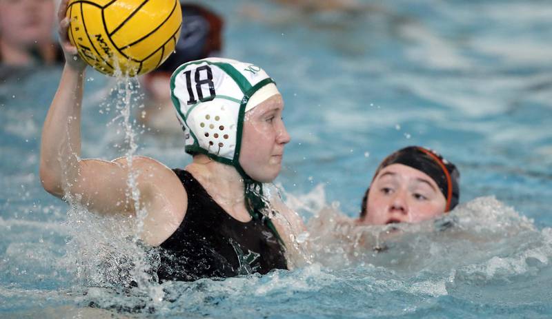 YorkÕs Jane Marlott (18) shoots over Hersey's Victoria Wrona (12) during the IHSA State Water Polo consolation match Saturday May 20, 2023 at Stevenson High School in Lincolnshire.