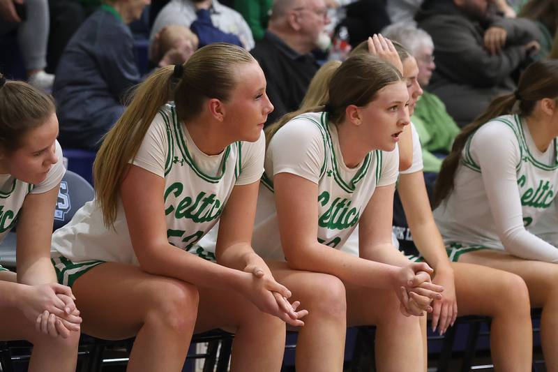 Providence Callahan sisters, Landrie, left, and Layken, sit out the final minutes in their 72-44 win over Hillcrest in the Class 3A Hillcrest Sectional championship game on Thursday, Feb. 26, 2026 in Hillcrest.