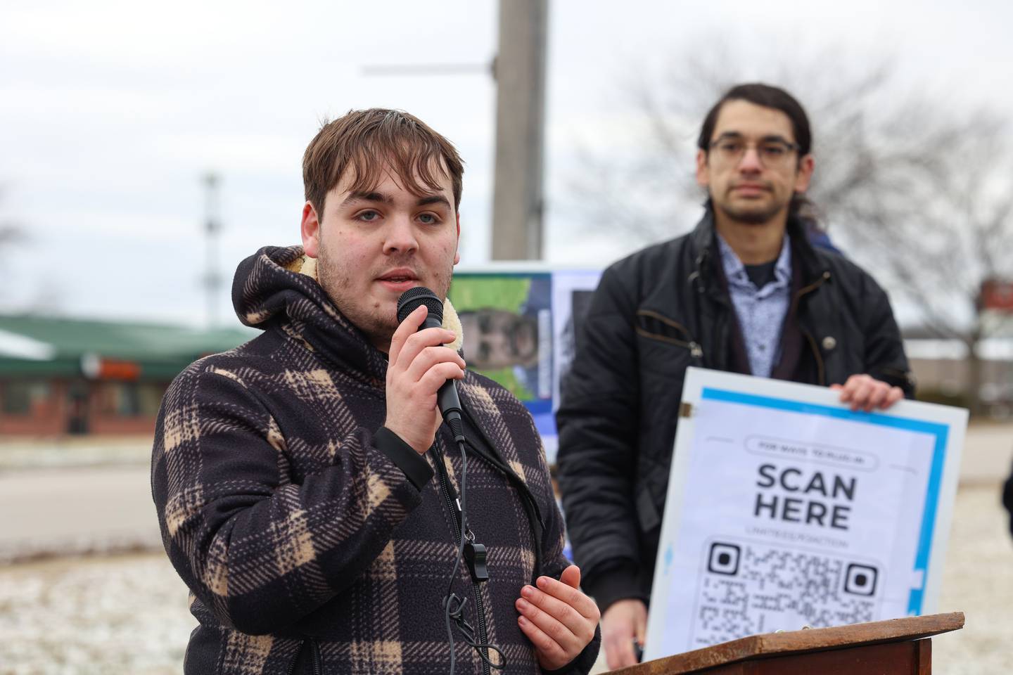 Dominic Compton, of Bourbonnais, speaks to the crowd of about 100 gathered for an ICE Out for Good protest and vigil at The Grow Center in Bourbonnais on Sunday, Jan. 11, 2026.
