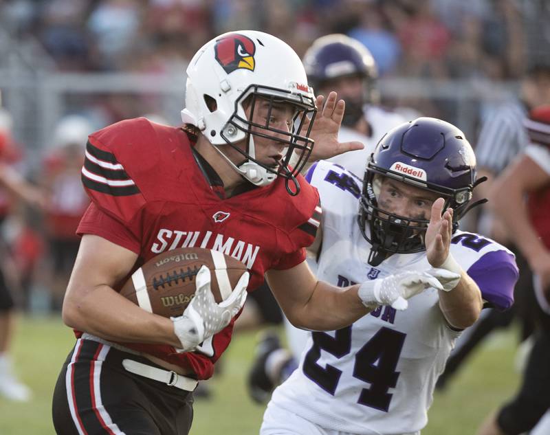 Stillman Valley back Henry Hilreth is eyed by Dixon’s Carter Kibble Friday, August 25, 2023.