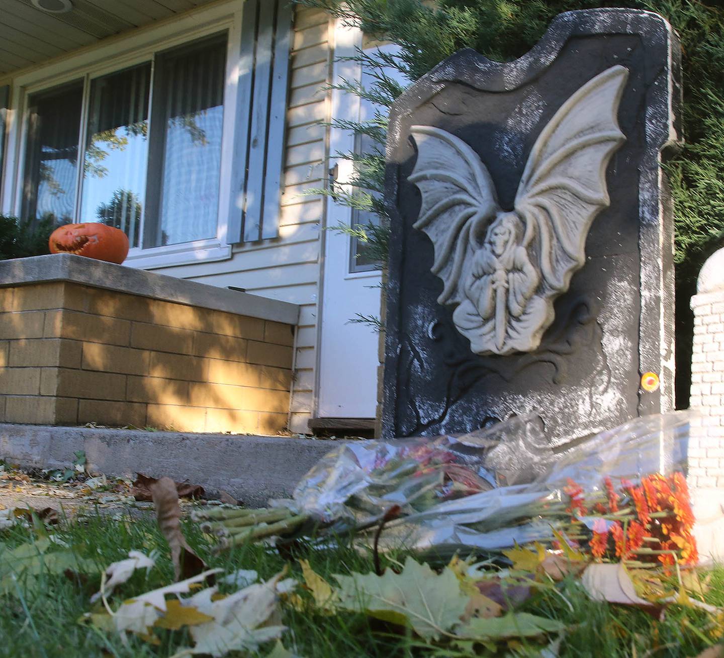 Flowers sit outside of the home in the 100 block of Tilton Park Drive in DeKalb where Kristopher M. Kramer, 33, of DeKalb, was fatally shot by DeKalb police on Monday, Oct. 25, 2021. Police said Kramer had threatened himself and others with a samurai sword and did not comply to officer requests to stand down.