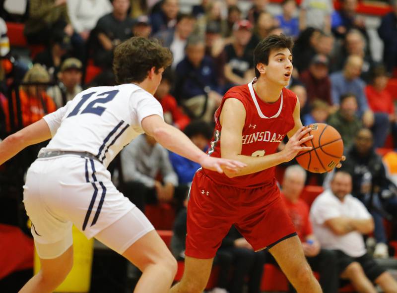 Hinsdale Central's Emerson Eck (3) looks for an outlet during the Hinsdale Central Holiday Classic championship game between Oswego East and Hinsdale Central high schools on Thursday, Dec. 29, 2022 in Hinsdale, IL.
