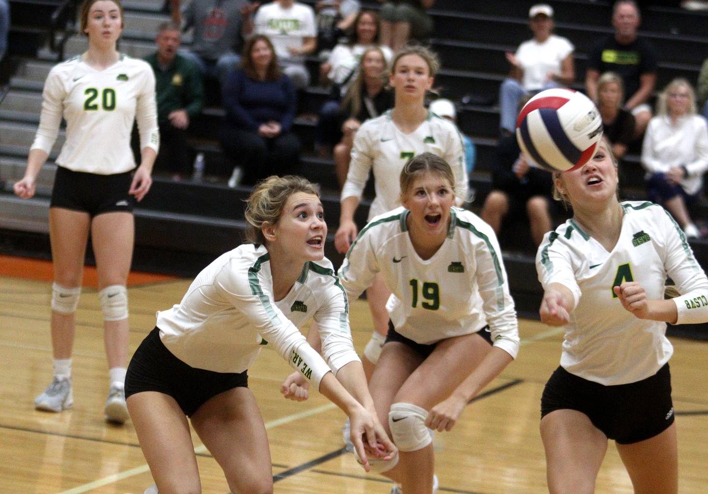 From left, Crystal Lake South’s Olivia Apt, Logan Georgy, and Bella Toniolo follow the ball in varsity volleyball at McHenry Tuesday night.