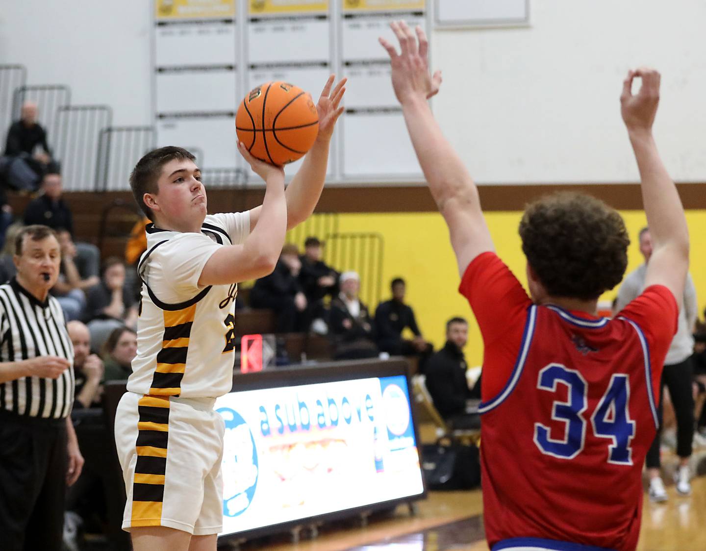 Jacobs' George Donze shoots the ball over Dundee-Crown's Hudson Reardon during a Fox Valley Conference boys basketball game on Tuesday, February. 3, 2026, at Jacobs High School in Algonquin.