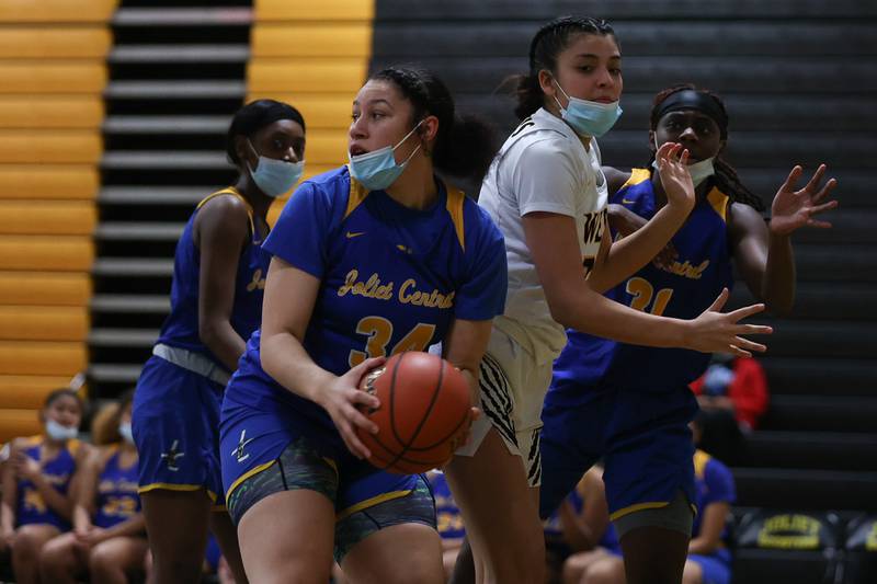 Joliet Central’s Nylah Davis looks to pass against Joliet West in the Class 4A Moline Regional semifinal. Tuesday, Feb. 15, 2022, in Joliet.