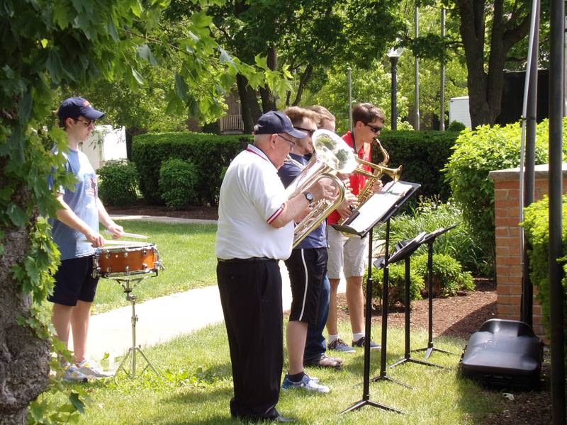 Tom Rice (front) leads a patriotic band of Streator musicians volunteering to play at the Memorial Day ceremony Monday, May 30, 2022, at Veterans Plaza in City Park in Streator.