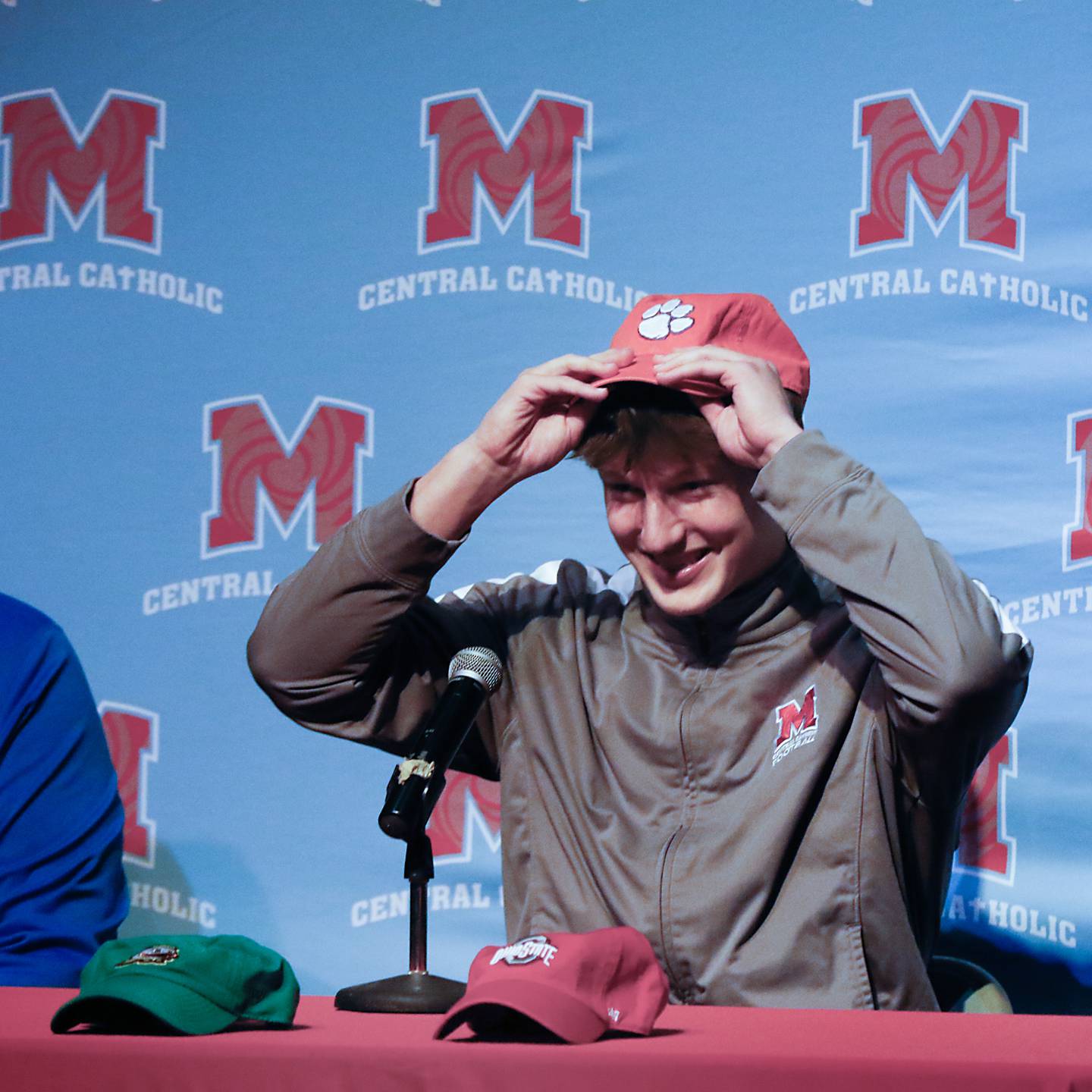 Christian Bentancur puts on a Clemson cap as he announces Friday, Jan. 13, 2023, that he will attend Clemson University to play Division I football, at Marian Central High School. Bentancur, a highly recruited tight-end, narrowed his section down to Clemson from his final three colleges. The other two colleges were Ohio State and Oregon universities.